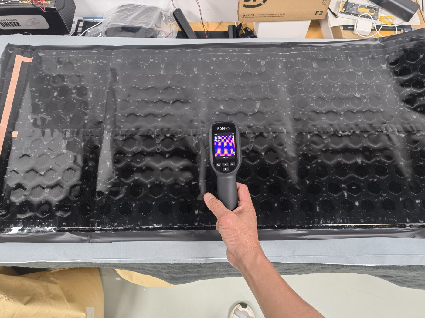 Thermal camera checking underfloor heating film